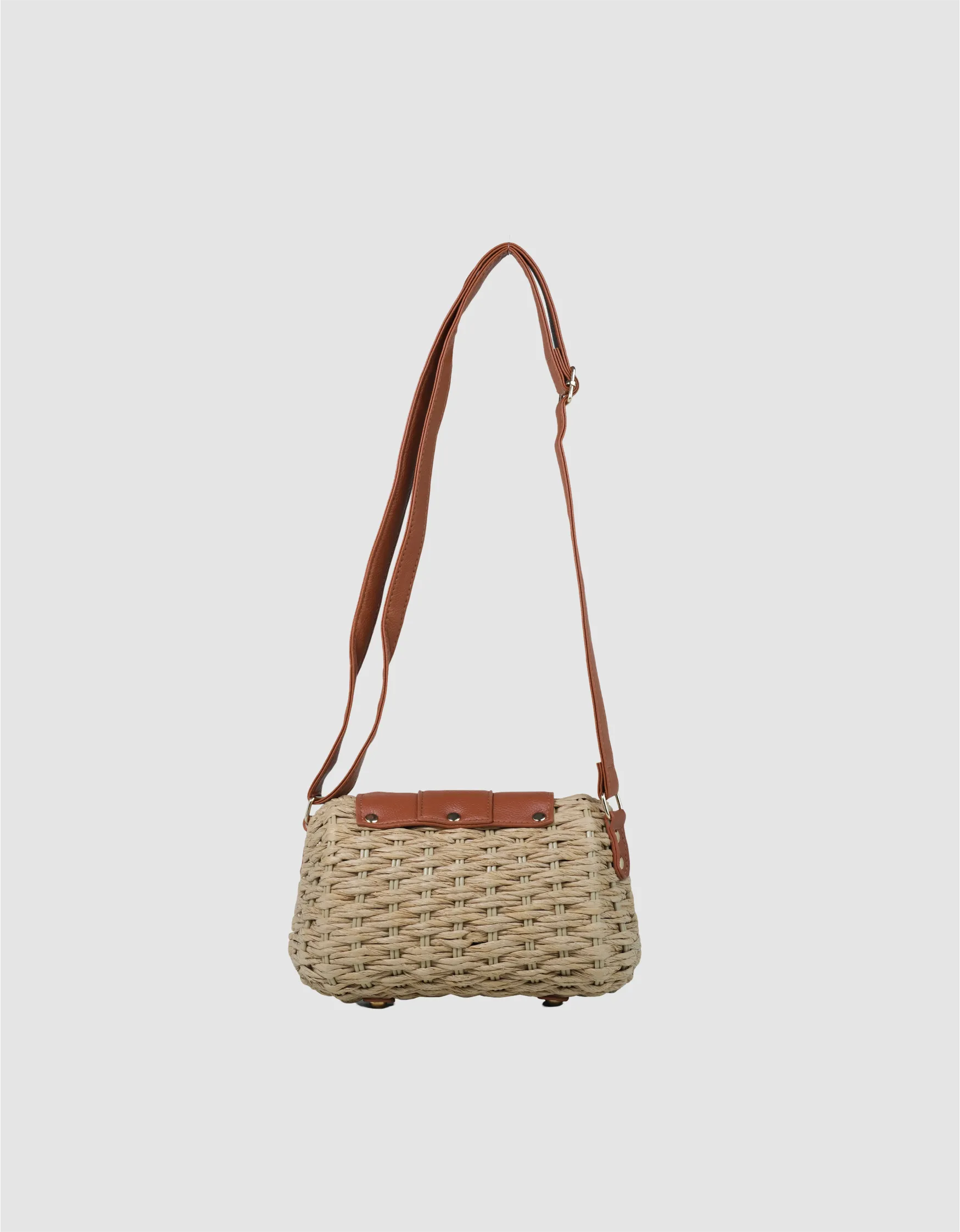 Trendy women’s Bali bag in beige with strap — summer sling bag for travel, beach, and casual wear.